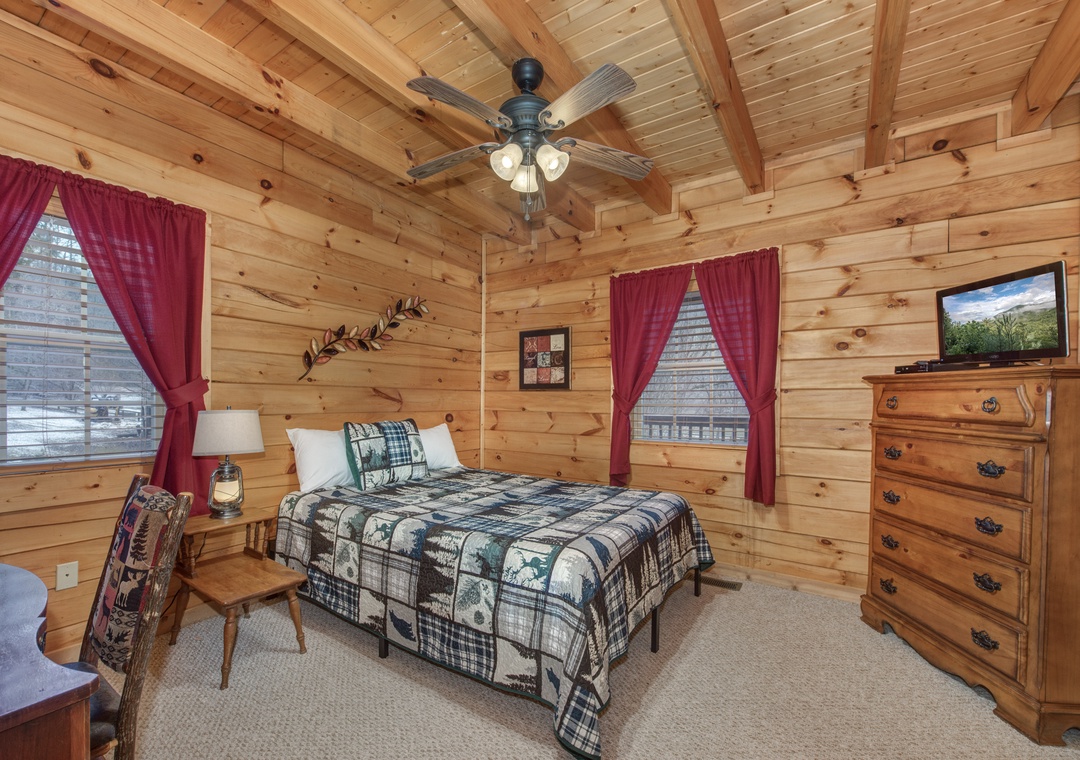 Cozy log cabin bedroom with rustic charm surrounds you in warmth and comfort for peaceful mountain nights.