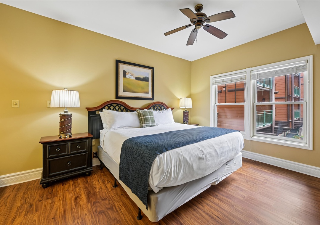 Sink into comfort with crisp linens and gentle ceiling fan breezes in your cozy bedroom retreat.