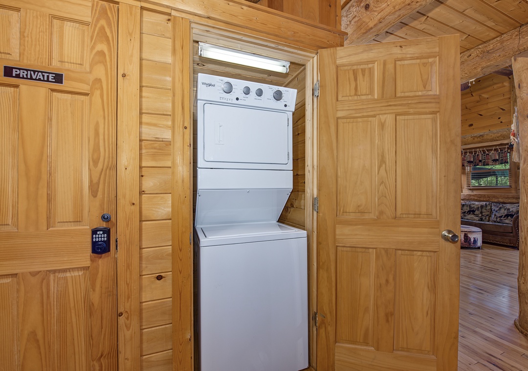 Your private laundry area features a convenient stacked washer and dryer combo tucked into its own closet, making it easy to keep fresh clothes throughout your stay.