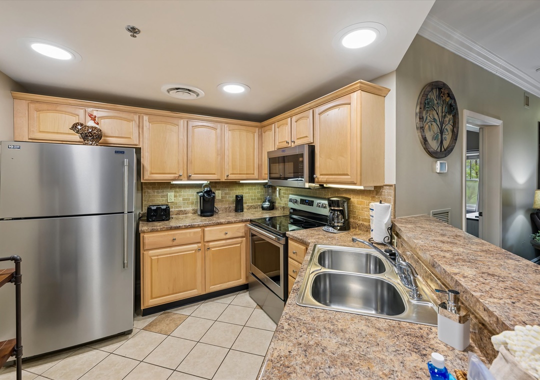 Cook your favorite meals in this fully equipped kitchen with granite counters, stainless appliances, and all the space you need.