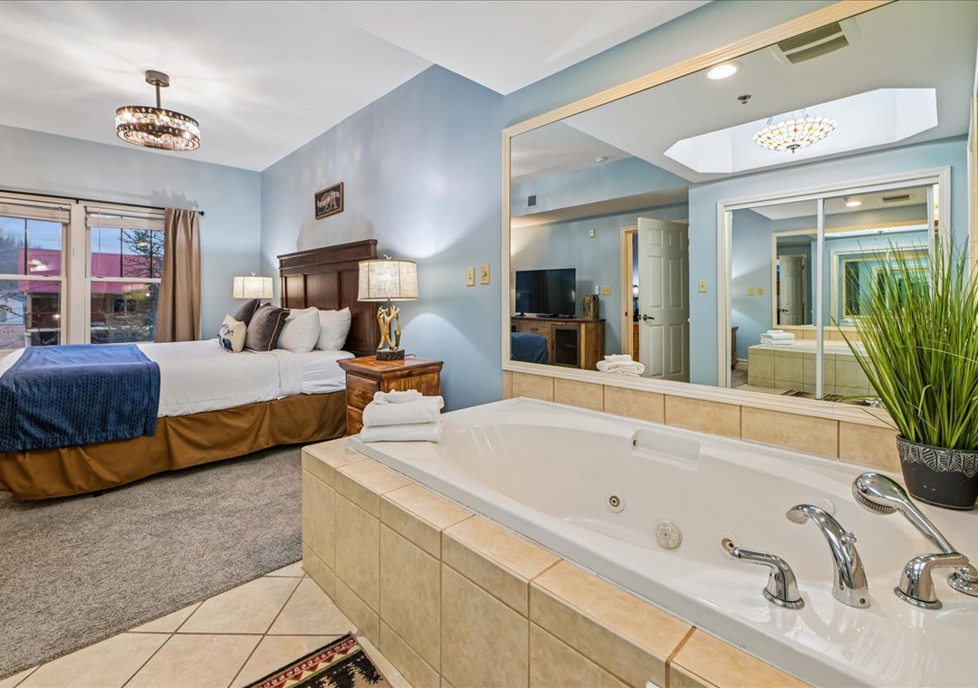 Relax in your suite with a luxurious jetted tub steps from your king bed. Soak away stress while enjoying the elegant decor.