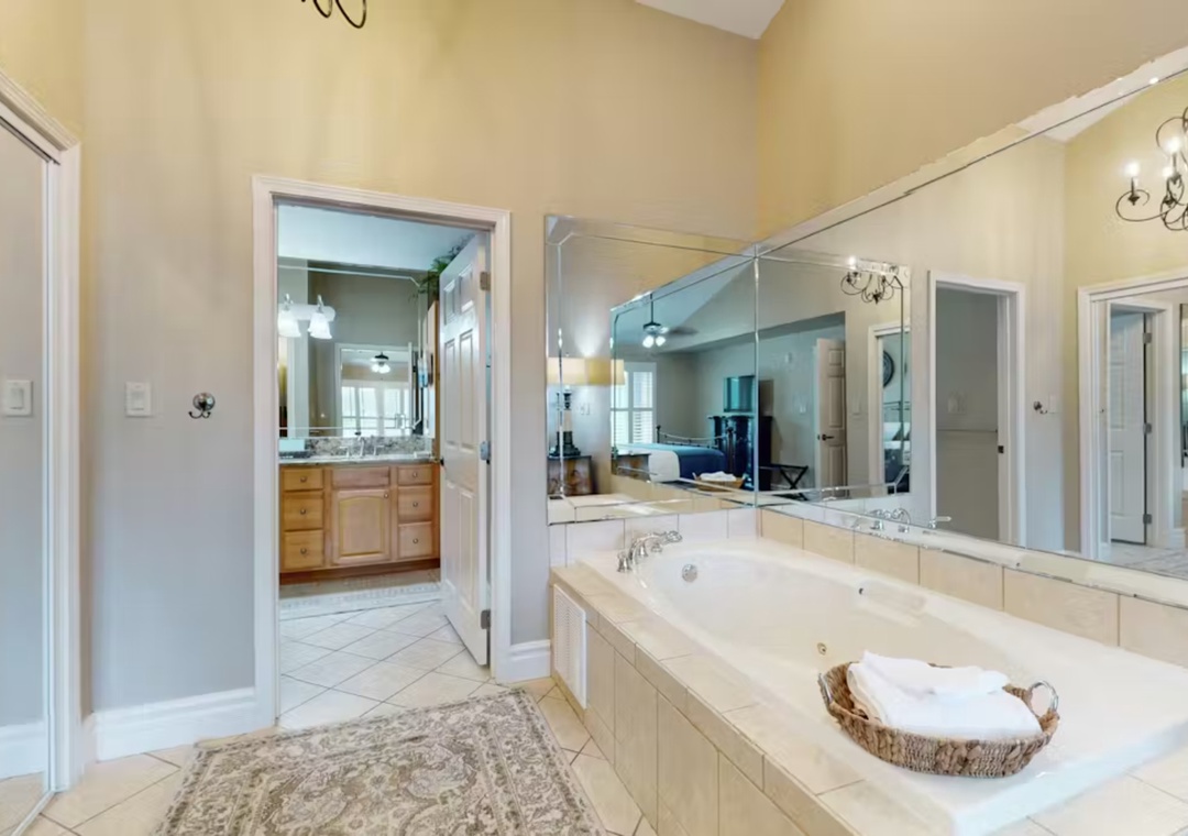 Indulge in your private spa retreat with a soaking tub, marble countertops, and thoughtful touches like soft towels to enhance your relaxation.
