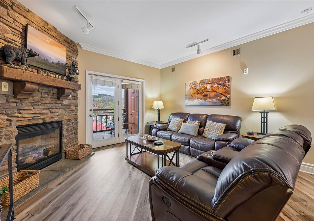 Sink into plush leather recliners by your stone fireplace, where rustic charm meets modern comfort in your mountain getaway.