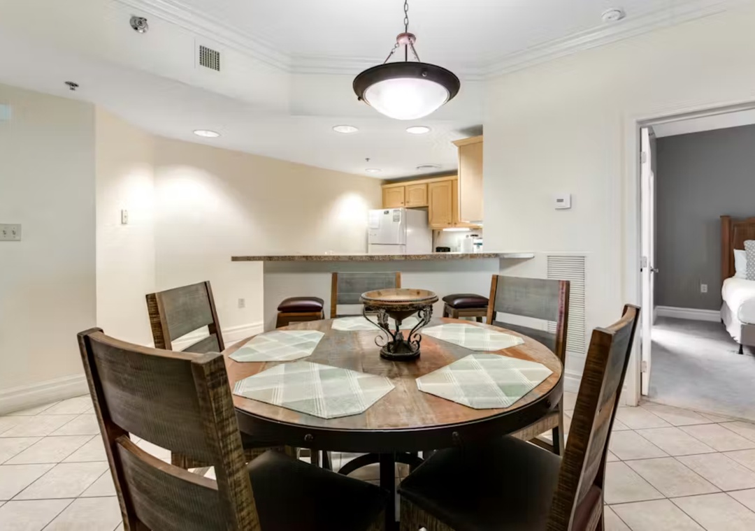 Gather around your elegant dining table for memorable meals, with the modern kitchen just steps away for easy entertaining.