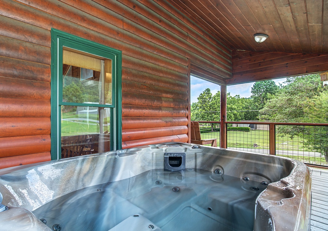 Soak away your cares in your private hot tub while taking in stunning views of the surrounding natural landscape from this covered deck.