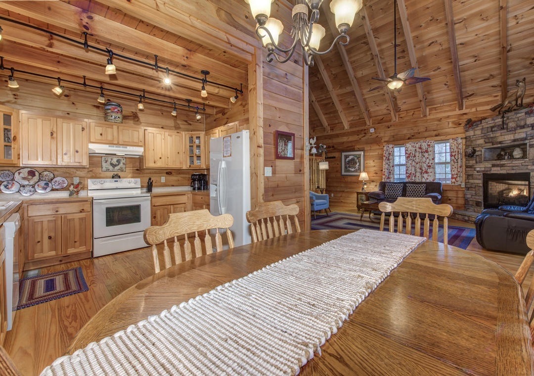 Gather around this rustic wooden dining table where your group can share meals beneath exposed beams and warm lighting.