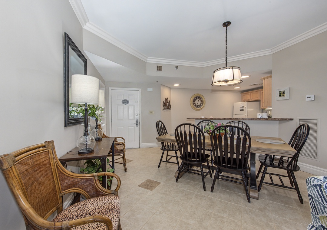 Gather around your elegant dining table with Windsor chairs, perfect for memorable meals together in this graciously appointed space.