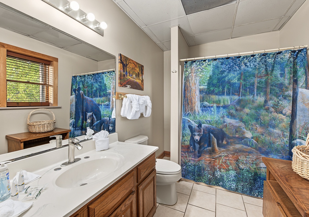 Your private bathroom features a dual-sink vanity, fresh towels, and cheerful natural light from the window—everything you need to feel right at home.