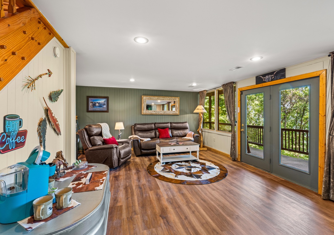 Step into your cozy retreat with warm wood floors, plush leather seating, and glass doors opening to lush forest views. Sip your morning coffee while taking in the serene surroundings from your private balcony.