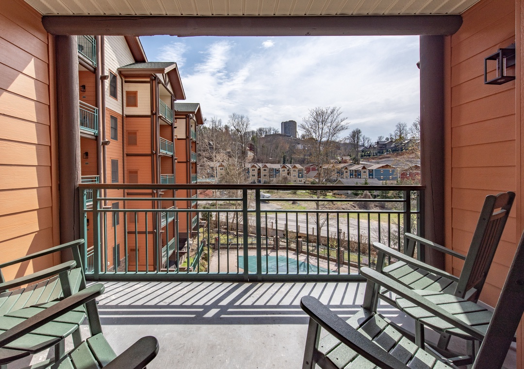 Your private balcony offers sweeping views of the community and surrounding cityscape, perfect for morning coffee or evening relaxation.