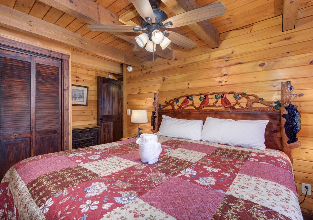 Cozy up in your rustic cabin bedroom with handcrafted wood details, beautiful quilt bedding, and authentic mountain charm.