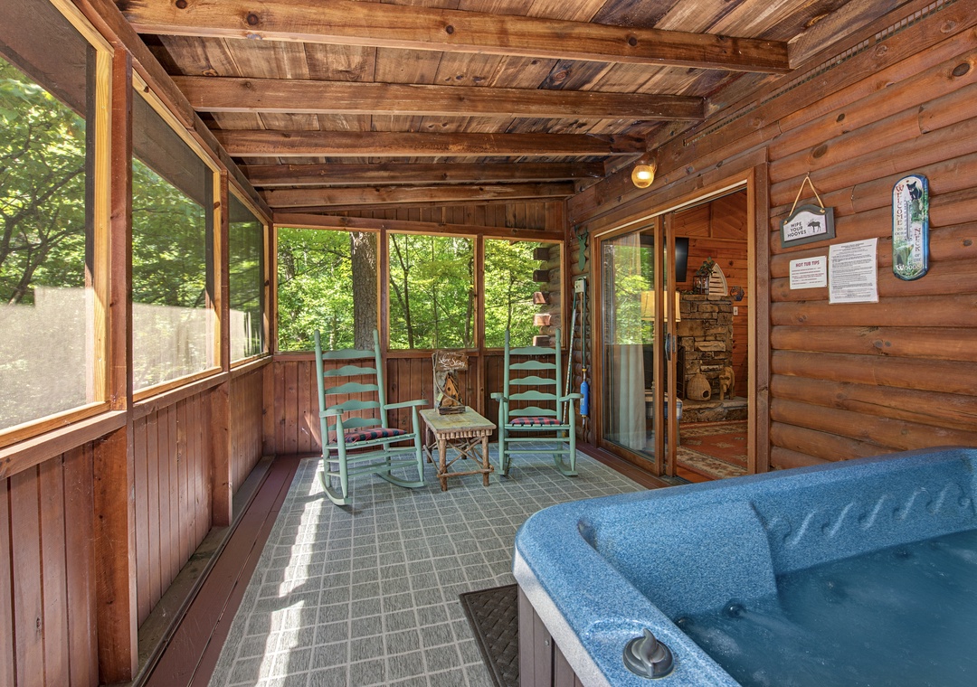 Unwind in your private screened porch, where gentle breezes and forest views create the perfect backdrop for morning coffee in the rocking chairs or an evening soak in the hot tub.