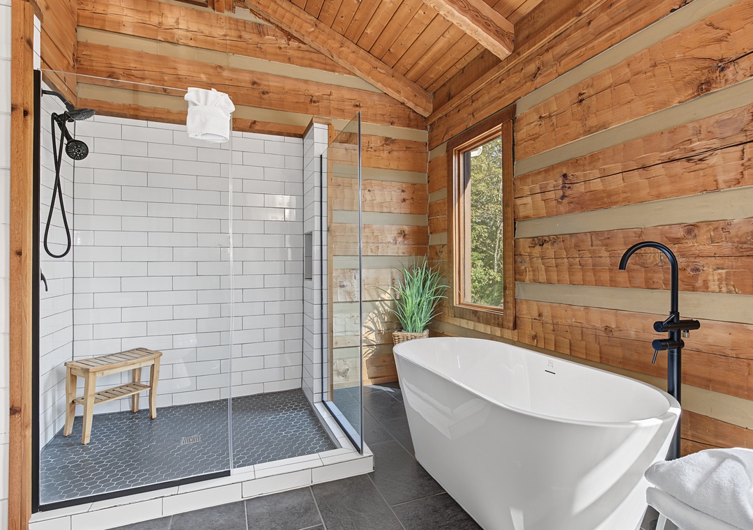 Soak in your private freestanding tub or refresh in the spa-inspired walk-in shower—this tranquil bathroom feels like your own woodland retreat.