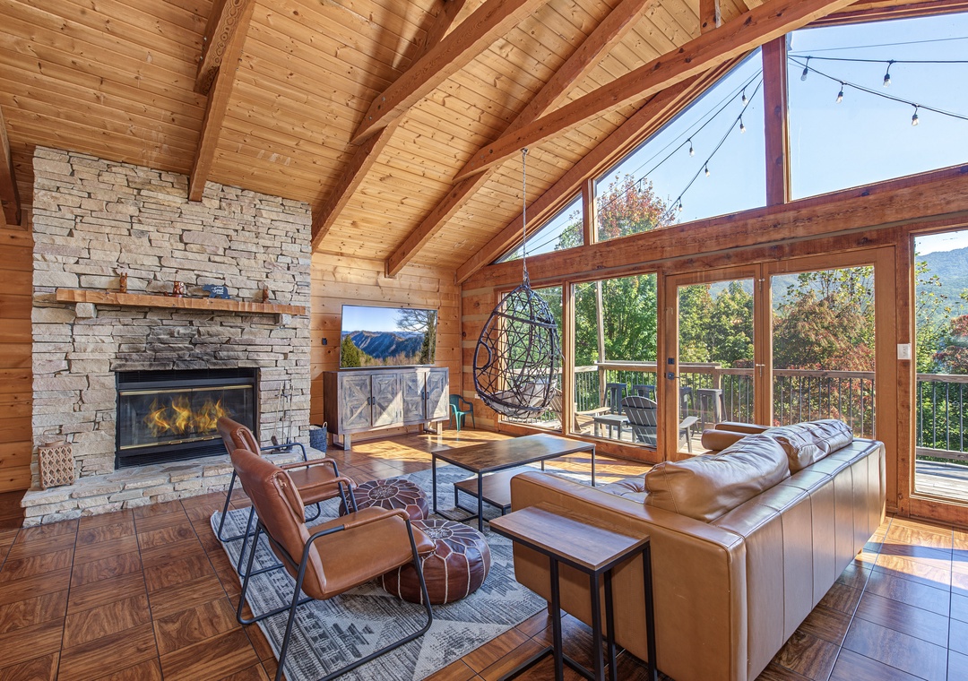 Curl up in your cozy retreat where vaulted wood ceilings, a stone fireplace, and sweeping mountain views create the perfect spot to unwind and reconnect.