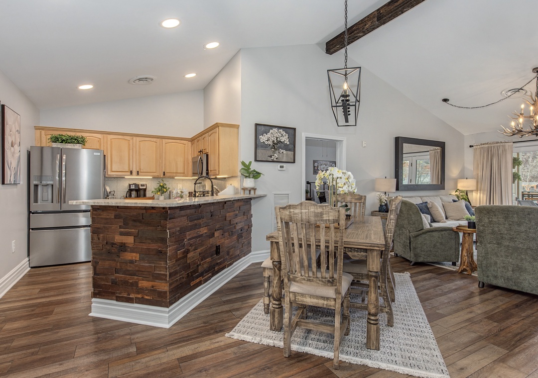 You'll love gathering in this open-concept space where rustic stone and warm wood blend beautifully with modern comfort.