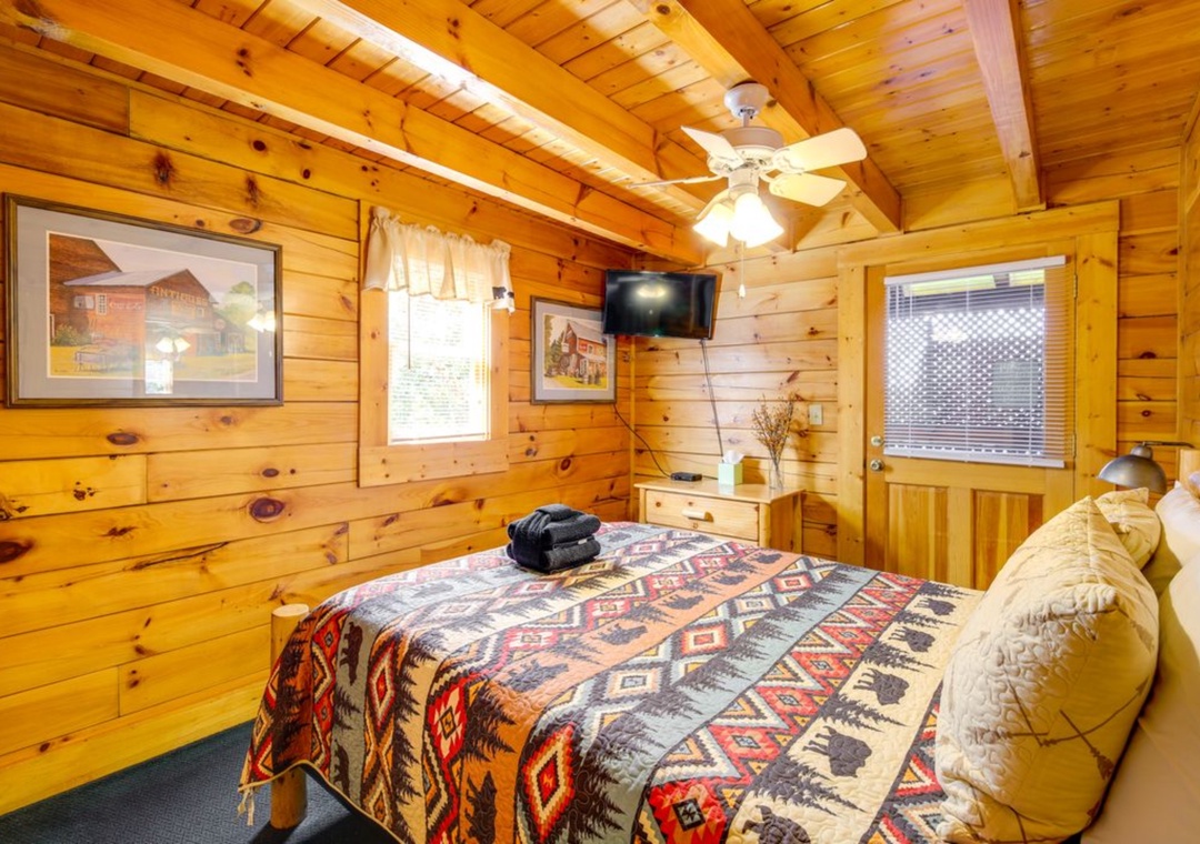Drift off to sleep surrounded by warm knotty pine walls and rustic charm. Your cozy cabin bedroom features authentic lodge decor and peaceful mountain vibes.