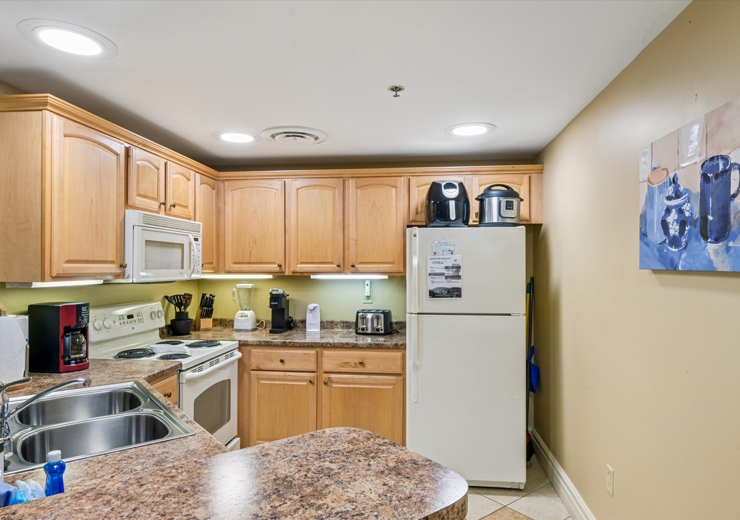 Your fully equipped kitchen awaits with granite counters, modern appliances, and everything needed to create memorable meals during your stay.