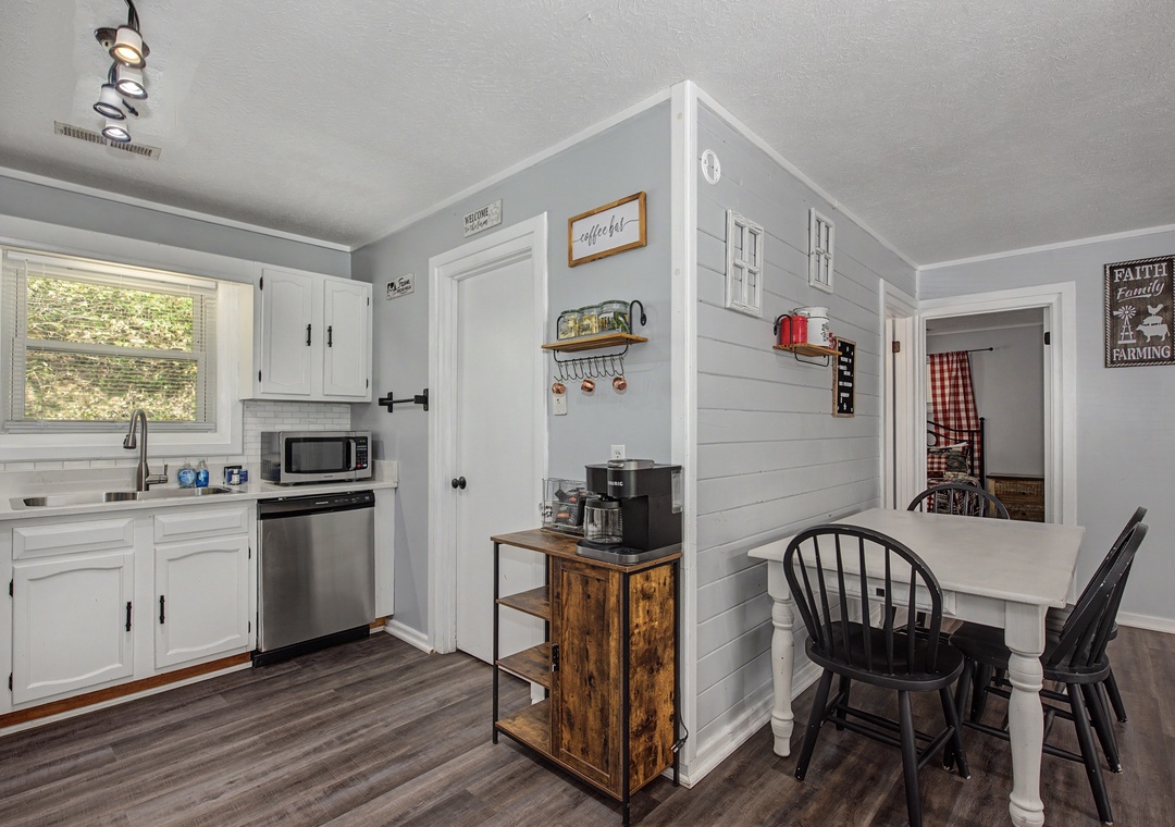 Cozy farmhouse-style kitchen with coffee station and breakfast nook makes your mornings feel like home.