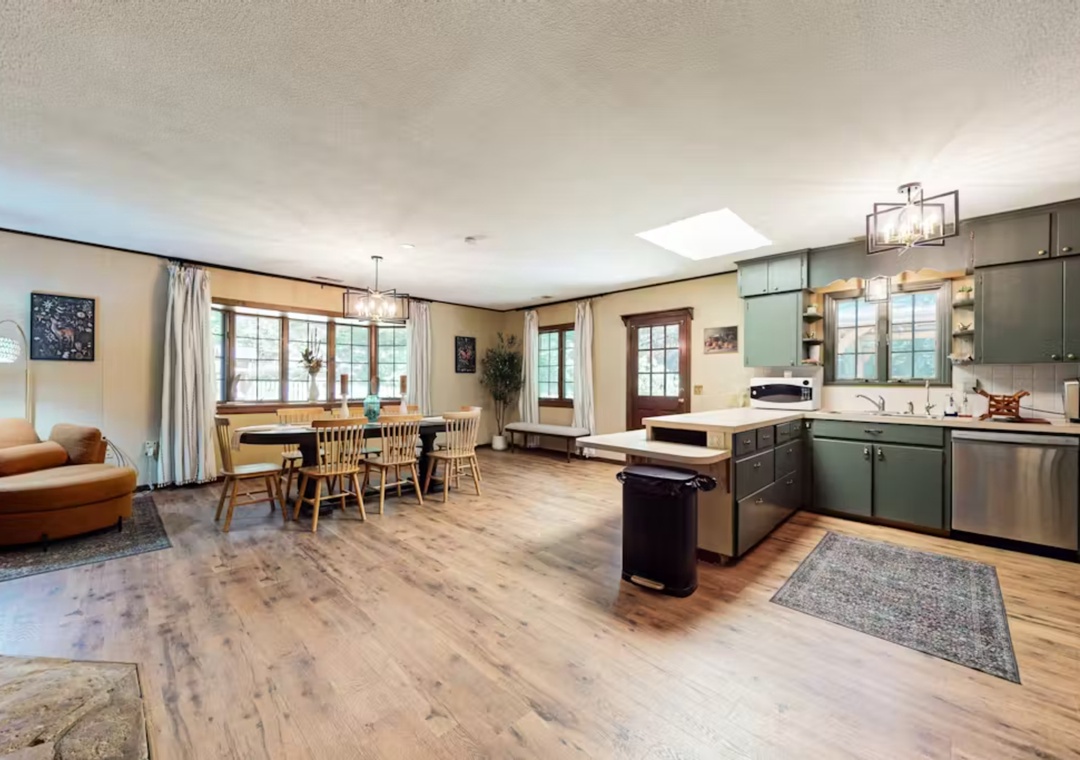 Your spacious open-plan haven combines modern comfort with rustic charm, featuring gleaming hardwood floors and abundant natural light.