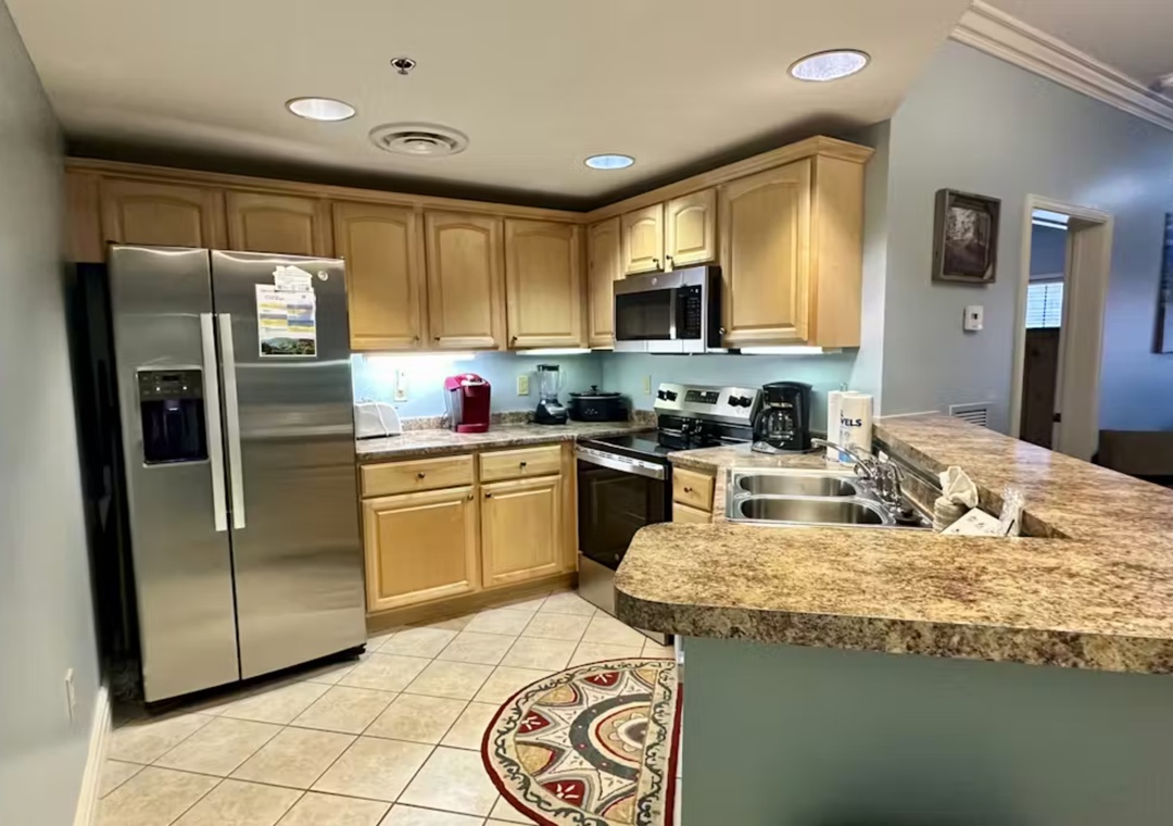 Your fully-equipped kitchen features granite countertops, stainless steel appliances, and everything needed for cooking memorable vacation meals together.
