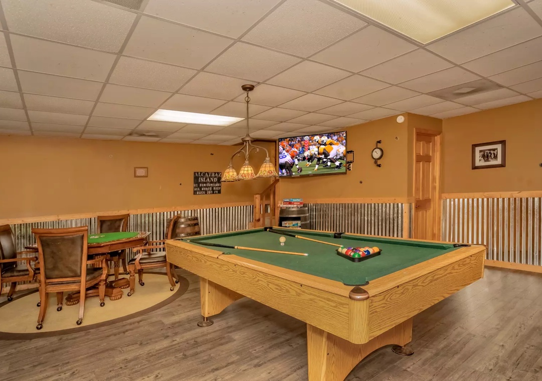 Your game room awaits with a beautiful pool table and card area, perfect for friendly competition and memorable evenings with loved ones.