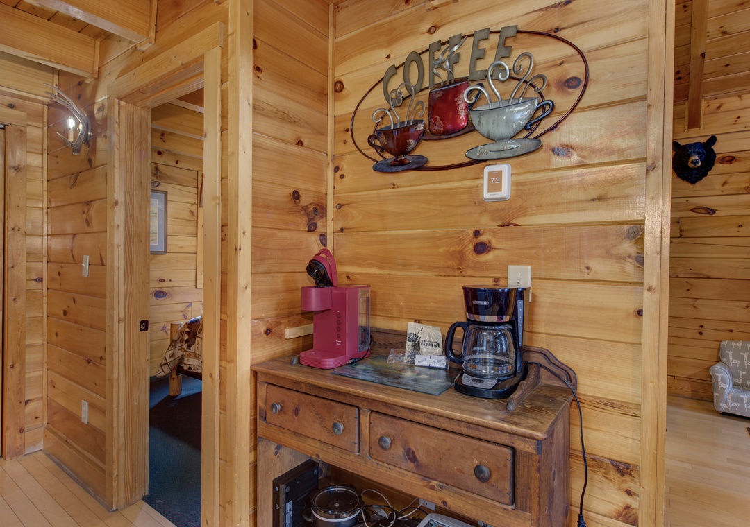 Wake up to fresh coffee in your cozy cabin retreat, where rustic charm meets morning comfort.
