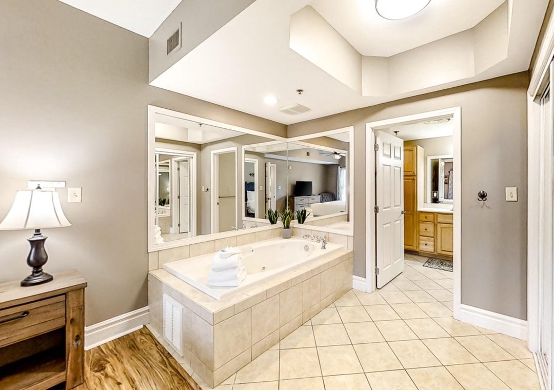 Indulge in luxury with your private spa-style bathroom featuring a spacious soaking tub, elegant finishes, and abundant natural light.