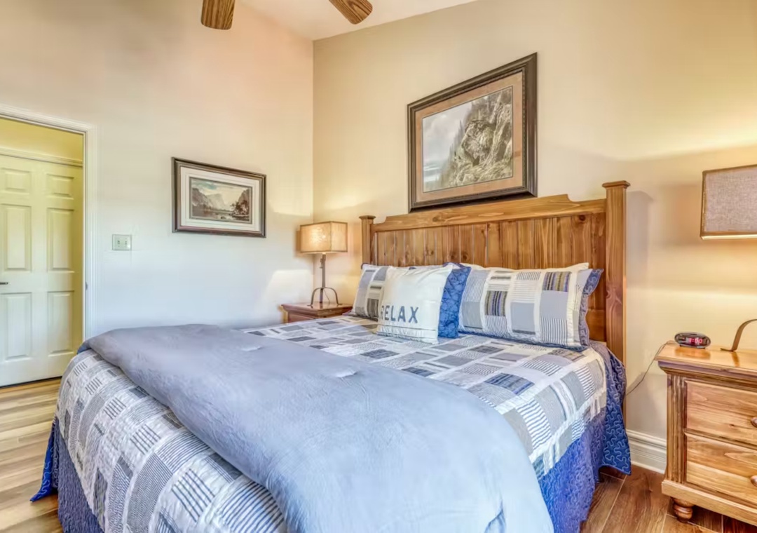 Drift off in this cozy bedroom with rustic wood details and peaceful artwork that sets the perfect tone for your mountain getaway.