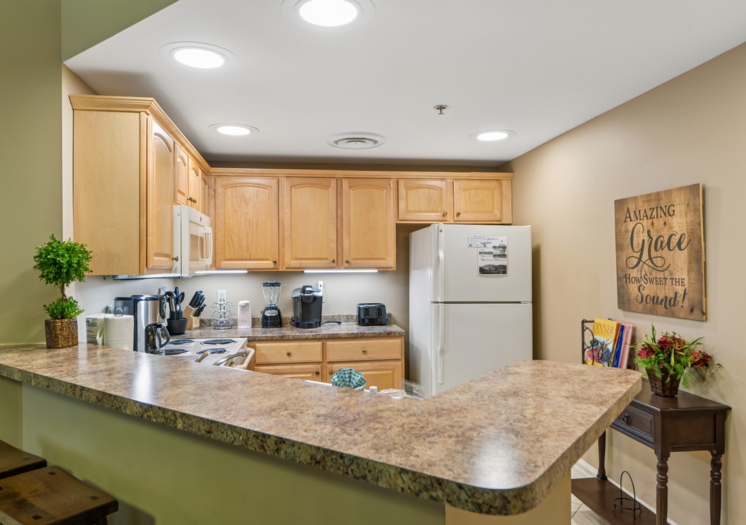 Your fully equipped kitchen features granite counters, modern appliances, and everything you need to prepare memorable meals during your stay.