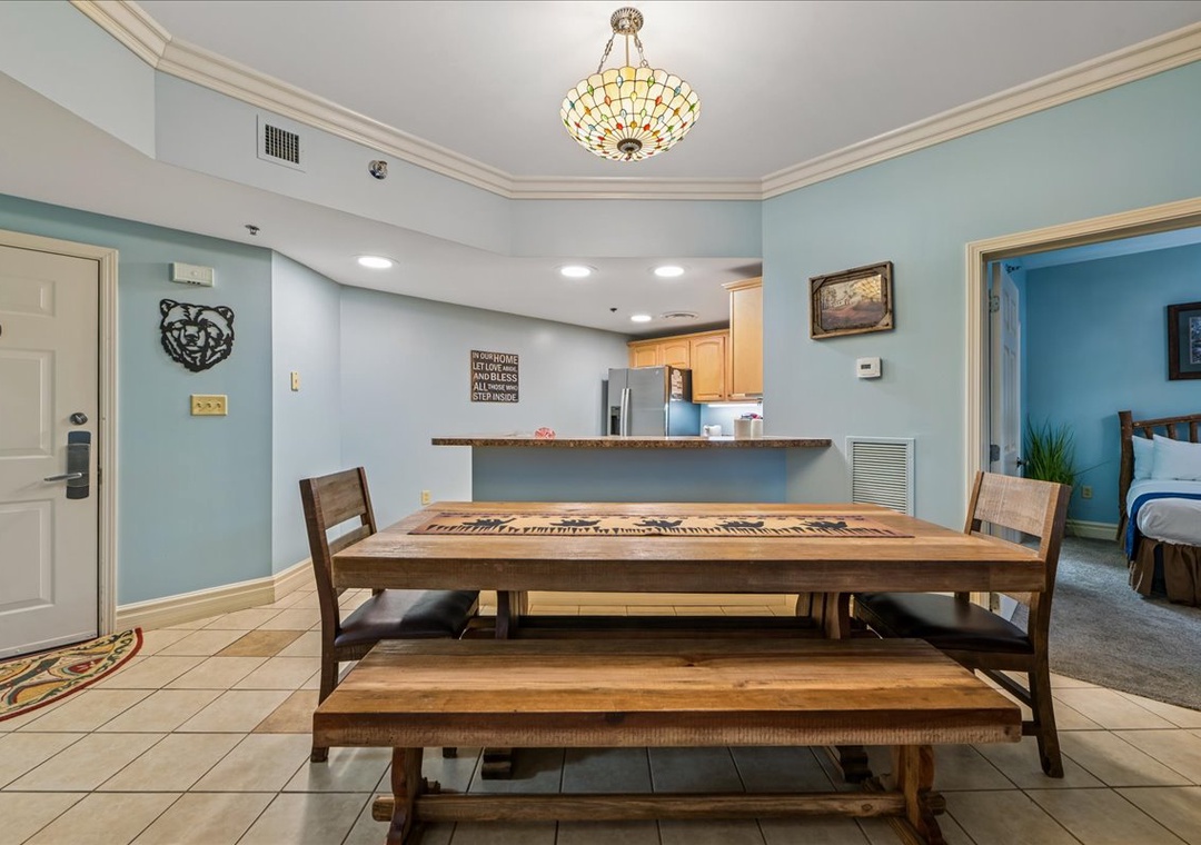 Gather around your spacious dining table with comfortable bench seating, where the open kitchen layout makes hosting effortless and memorable.