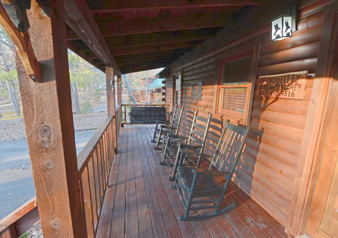 Settle into your private covered porch with classic wooden rockers, perfect for morning coffee or evening relaxation.