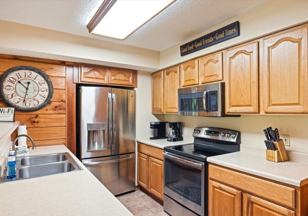 Your fully-equipped kitchen features stainless steel appliances, granite counters, and warm wood cabinets - perfect for preparing memorable meals together.