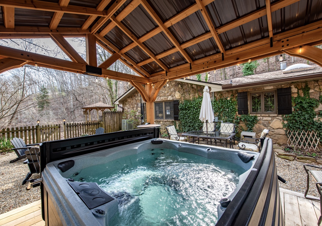 Slip into your private hot tub beneath this beautiful wooden pavilion and let the bubbling water melt your stress away.