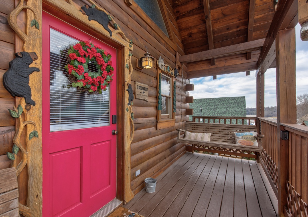 Relax on your private covered porch with rustic charm and scenic mountain views.