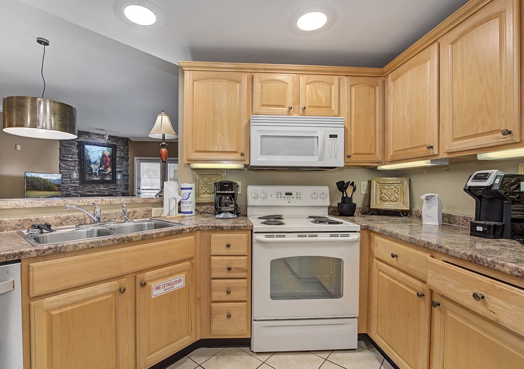 Your fully equipped kitchen offers granite counters, quality appliances, and warm wood cabinetry for preparing memorable meals together.