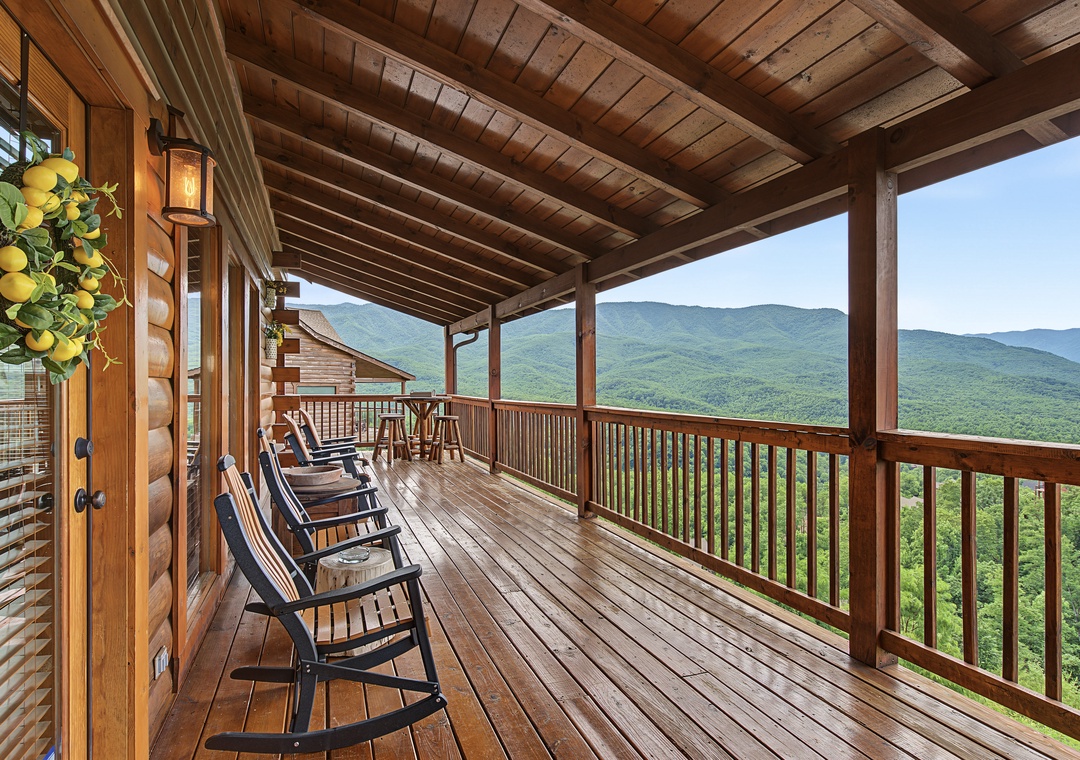 Sweeping mountain views stretch before you from this covered deck, where rocking chairs invite peaceful mornings and evenings breathing in the crisp mountain air.