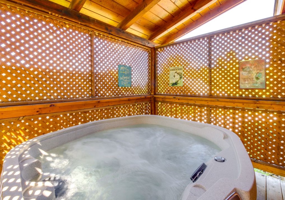 Slip into your private hot tub sanctuary, where warm latticed sunlight dances through wooden screens, creating the perfect ambiance for relaxation.