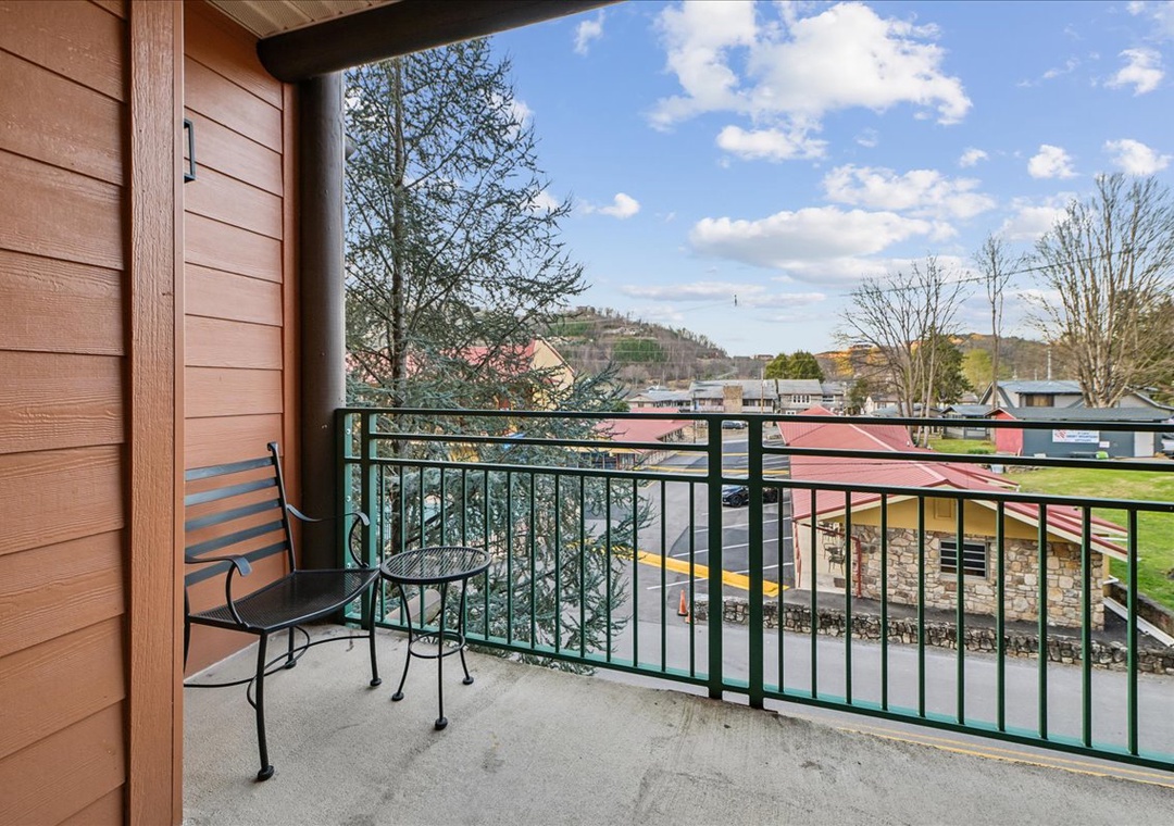 Step onto your private balcony and savor morning coffee while taking in sweeping mountain and town views that stretch to the horizon.