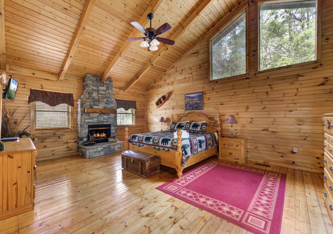Cozy up in this charming log cabin bedroom where rustic wood meets warm comfort, complete with a crackling fireplace for intimate evenings.
