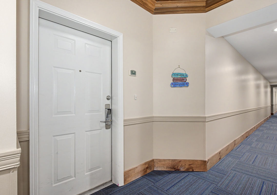 Well-appointed hallway with charming coastal decor leads you to your comfortable retreat, featuring thoughtful details and elegant finishes throughout.