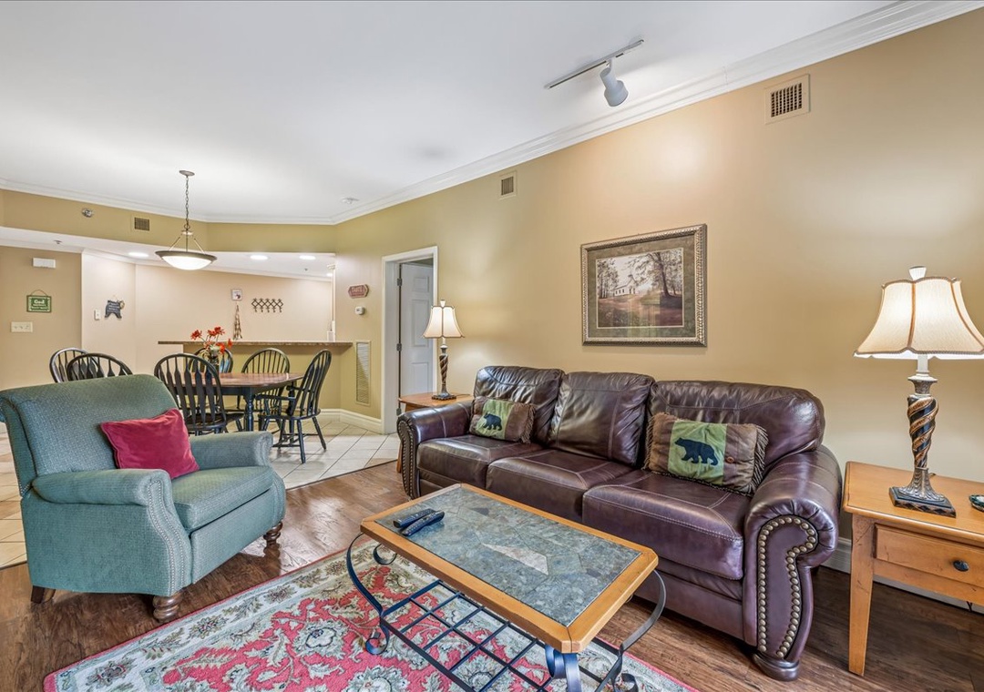 Sink into plush leather seating in your spacious living area, where warm lighting and thoughtful touches create the perfect retreat.