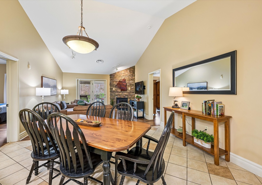 Gather around your warm dining table for memorable meals together, with cozy living spaces and stone fireplace just steps away.