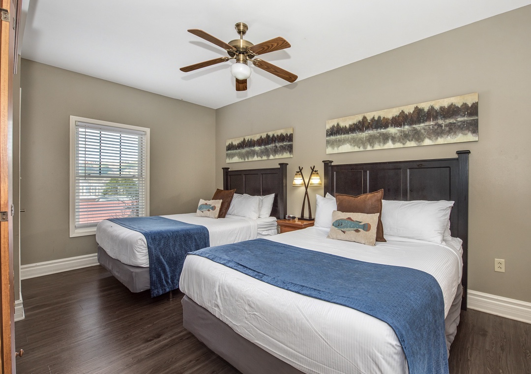 Sleep soundly in your cozy bedroom featuring two comfortable beds with crisp linens and nature-inspired artwork creating a peaceful retreat.