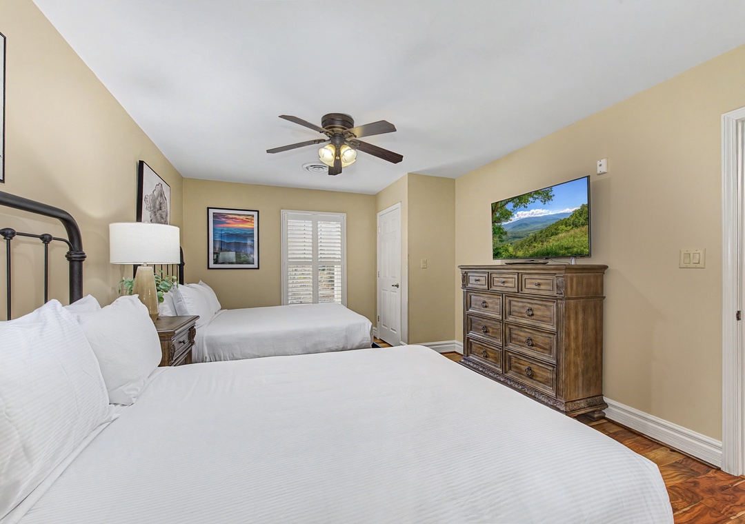 Drift into peaceful sleep in this comfortable bedroom with crisp linens and mountain views on your bedside TV.