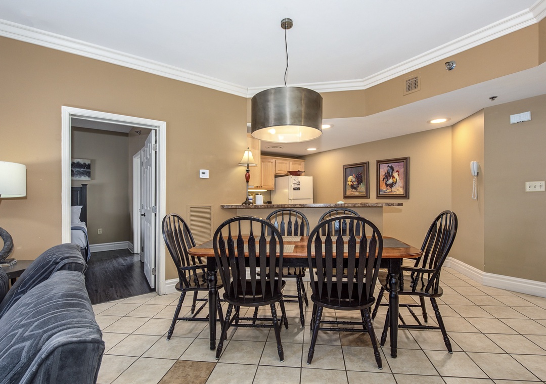 Gather around your spacious dining table for memorable meals with loved ones in this warm, inviting space.