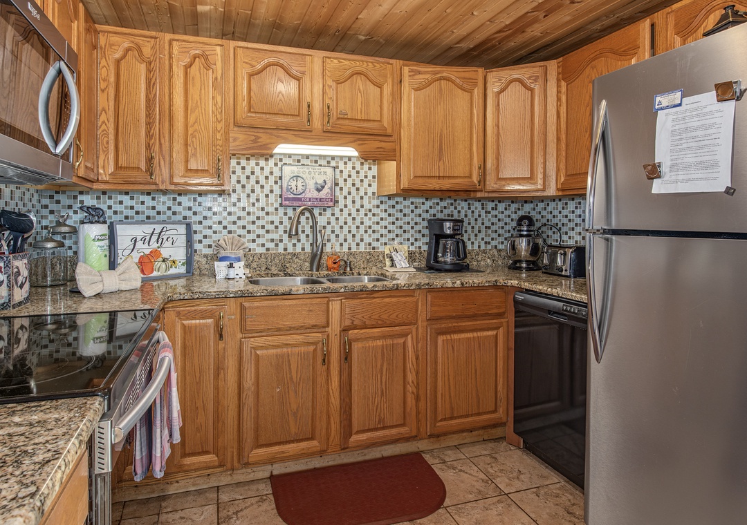 Your fully-equipped kitchen features granite countertops, stainless steel appliances, and everything you need to prepare meals during your stay—from the coffee maker for leisurely mornings to ample counter space for cooking.