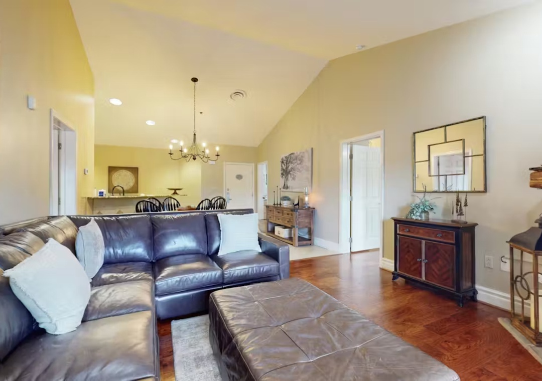 Relax in this bright, open living space where plush leather seating meets elegant touches, perfect for unwinding after your adventures.