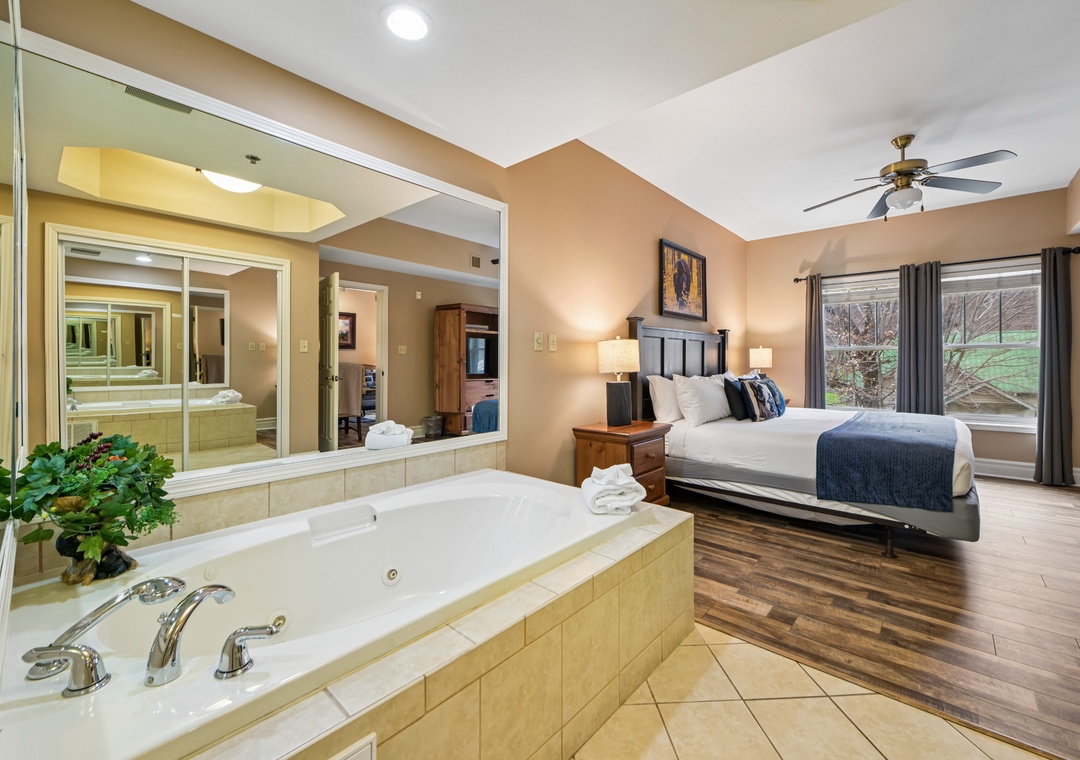 Unwind in your spacious suite featuring a luxurious jetted tub and cozy king bed with beautiful garden views.