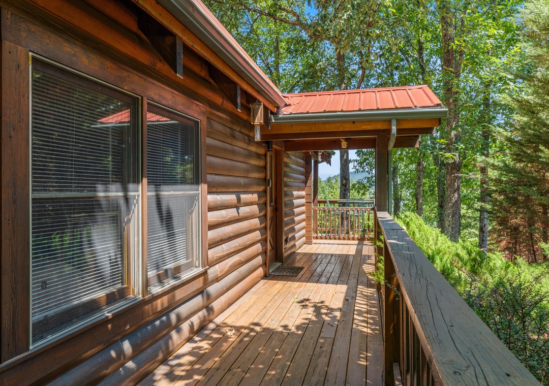 Step onto your private wraparound deck and breathe in the fresh mountain air, surrounded by towering trees and peaceful forest views.