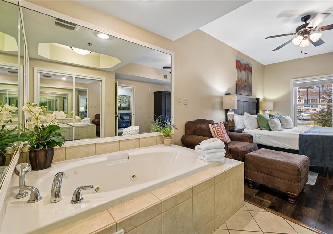 Indulge in luxury with your private jetted tub overlooking the bedroom—perfect for romantic evenings after exploring the area.